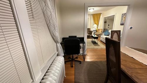 a living room with a couch and a chair and a living room at Cozy Albany Home in Albany