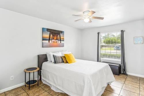 a bedroom with a bed and a ceiling fan at 3192 Birdseye Cir in Gulf Breeze