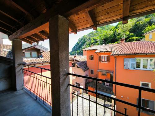 a view from a balcony of orange buildings at La Bretonne in Feriolo