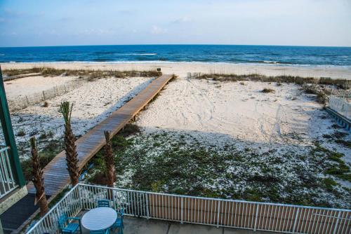 a view of the beach from the balcony of a condo at Beautiful 3 Bedroom BEACHFRONT Condo (F3) - Sleeps 10 in Gulf Shores