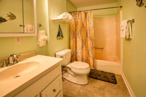 a bathroom with a toilet and a sink and a shower at Super Cute With Deeded Beach Access (#26) - Sleeps 5 in Gulf Shores
