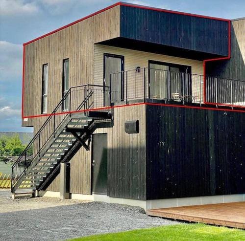 a building with a staircase on the side of it at New and modern entire rental unit in Ås/Ski Norway in Ås