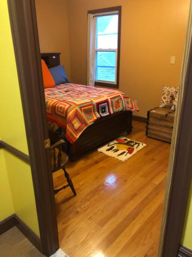 a bedroom with a bed and a window at Room to stay in in South Ozone Park