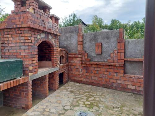 a large brick wall with a brick oven in it at Medina in Sarajevo