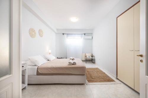 a bedroom with a bed with a teddy bear on it at Horizon Villa-Private Pool-7 Bedroom-Gym-Sea View in Psalidi