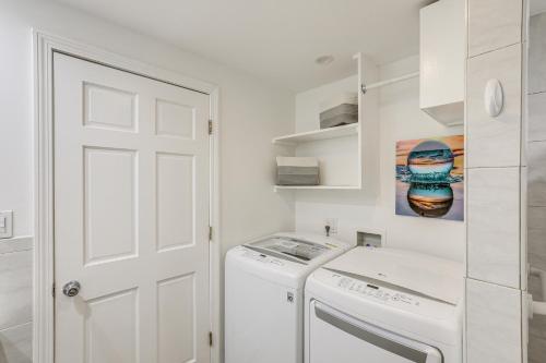a white laundry room with a washer and dryer at Beachfront Salisbury Retreat with Fire Pit and Grill in Salisbury