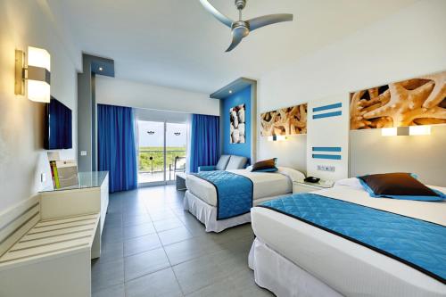 Postel nebo postele na pokoji v ubytování Riu Dunamar - All Inclusive