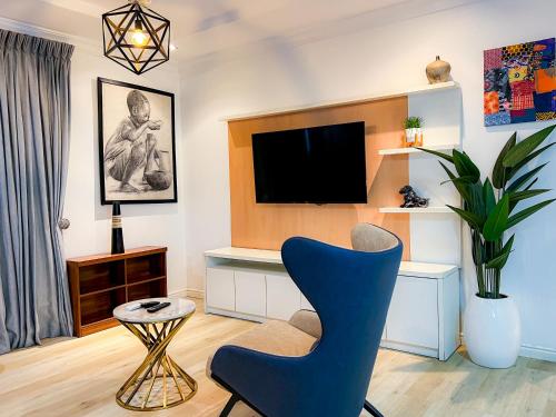 TV a/nebo společenská místnost v ubytování Box Residence