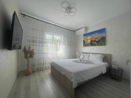 Giường trong phòng chung tại CASA ELLA