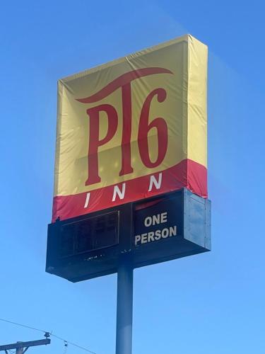 a sign for a one person gas station at PT 6 INN in Evansville