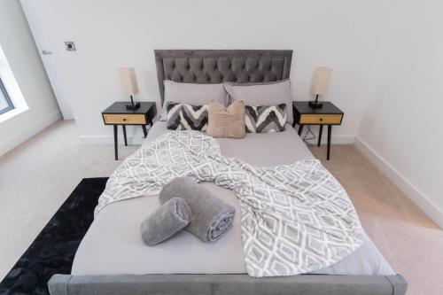 a bedroom with a large bed with two night stands at The Broad Oaks in Olton