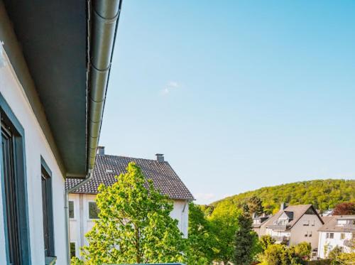 a view of a house with trees and houses at Mey Boardinghouse in Bielefeld