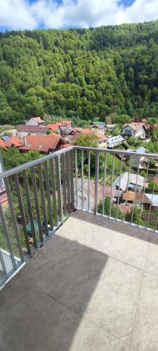 a balcony with a view of a town at STUDIO JACUZZI BELLE VIEW SINAIA-free parking in Sinaia