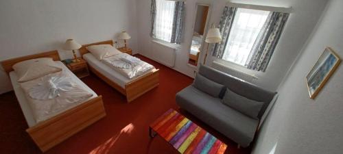 Una cama o camas en una habitación de Hotel Zittauer Hütte