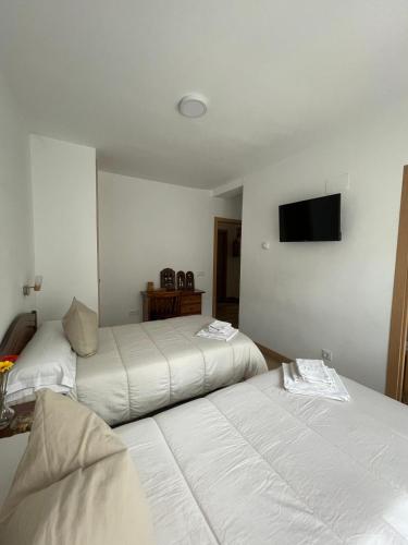 Postel nebo postele na pokoji v ubytování Casa rural Gerardo