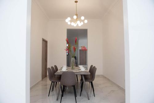 a dining room with a table and chairs at CASA BIANCA Bella Vista in Panama City