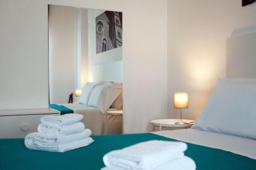 Postel nebo postele na pokoji v ubytování Aparthotel Le Marine