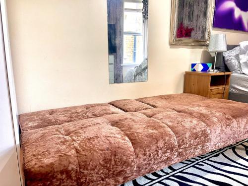 a bed sitting in a bedroom with at Comfy Double bedroom with a Private Toilet in London