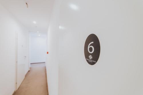 a door with the number six on it at Old Town Residence Rooms in Sarajevo
