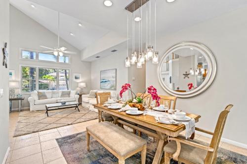 a dining room with a table and chairs at The Sun Dial - 827 in Siesta Key