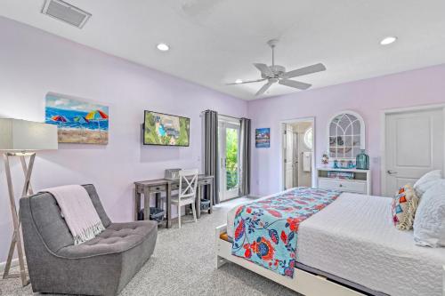 a bedroom with a bed and a chair and a desk at The Sun Dial - 827 in Siesta Key