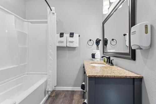 a bathroom with a sink and a shower at Coyote Mountain Lodge in Estes Park