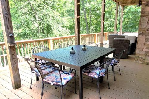 a blue table and chairs on a porch at Flyers' Landing in Jacksboro