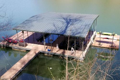 a house on a dock in the water at Flyers' Landing in Jacksboro