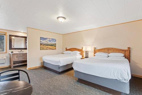 Ένα ή περισσότερα κρεβάτια σε δωμάτιο στο Discovery Lodge