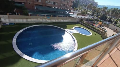 a swimming pool on the balcony of a building at Holiday Marina D'or in Oropesa del Mar