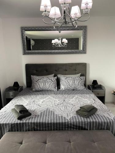 a bedroom with a large bed with a large mirror at Villa Astoria 5. Sveti Vlas k.k. Elenite in Sveti Vlas