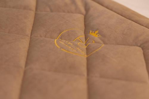 a heart applique on the back of a couch at Hotel Joni Premium in Ksamil