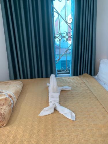 Кровать или кровати в номере Tam Coc White Swan Homestay