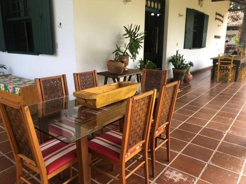 a dining room with a table and chairs at Hospedaria Nova Era in Rio Novo