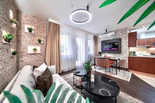 a living room with a couch and a table at One bed apartment at central location in Budapest in Budapest