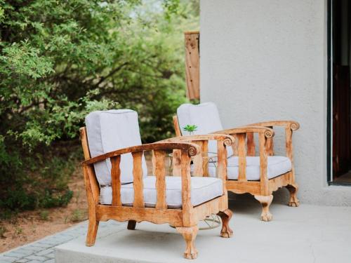 a pair of chairs sitting on a porch at Maroelani Lodge- Greater Kruger Private Reserve in Hoedspruit