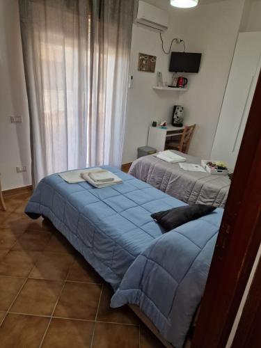 Ένα ή περισσότερα κρεβάτια σε δωμάτιο στο Le stanze di Aurora