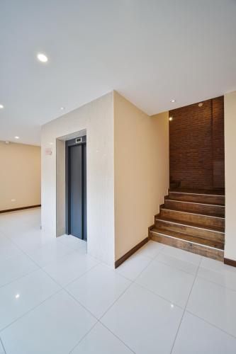 an empty lobby with stairs in a building at Chairu Eco Hotel in Santa Cruz de la Sierra