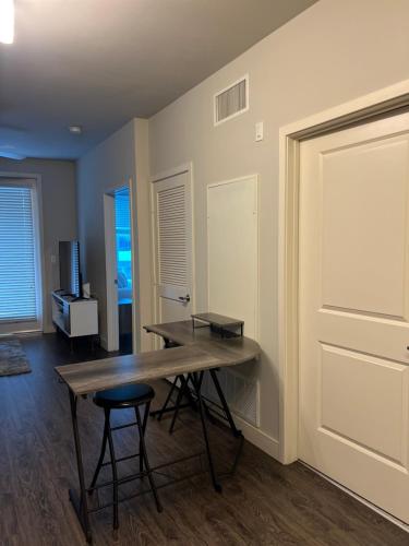 a room with a table and a stool and a door at 1 Bdr Apt in Irvine - Near John Wayne in Irvine