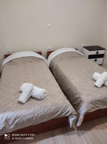 Un pat sau paturi într-o cameră la Kalipso home