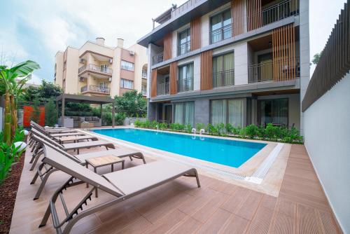 an image of a swimming pool at a building at Bomo Suites in Antalya