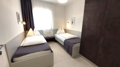 Ένα ή περισσότερα κρεβάτια σε δωμάτιο στο Paganor Apartments