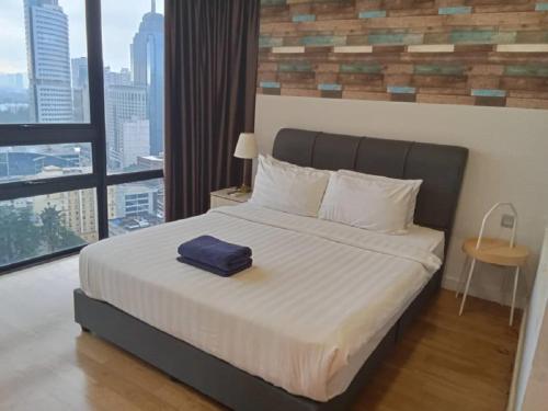 Tempat tidur dalam kamar di Anggun Residence Kuala Lumpur