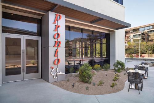 a building with a sign on the side of it at Caesars Republic Scottsdale, a Hilton Hotel in Scottsdale