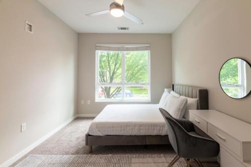 a bedroom with a bed and a window at Green Stone in Greenville