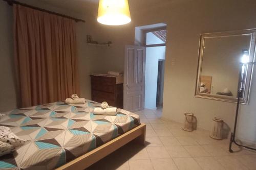 Кровать или кровати в номере Mycenae rustic house, Ολόκληρο σπίτι στις Μυκήνες