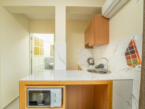 Η κουζίνα ή μικρή κουζίνα στο Residencial LiviaMilena Santa Maria