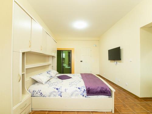Ένα ή περισσότερα κρεβάτια σε δωμάτιο στο Residencial LiviaMilena Santa Maria