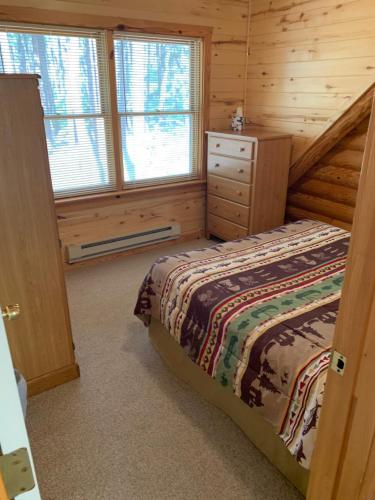 Postel nebo postele na pokoji v ubytování Bear Paw Lodge & Vacation Homes