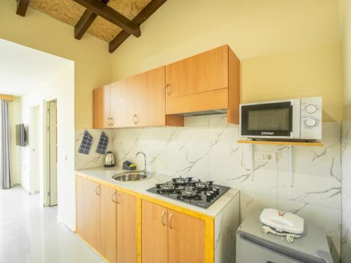 Η κουζίνα ή μικρή κουζίνα στο Residencial LiviaMilena Santa Maria